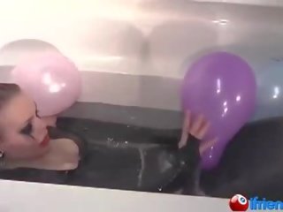 Lateks dressed söýgülim with balloons in a bathtub