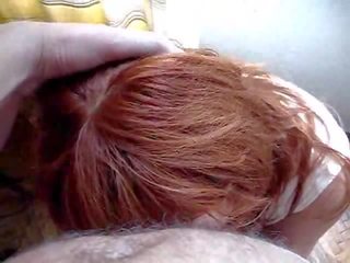 Attractive redhead on her knees sucking dick and balls mov